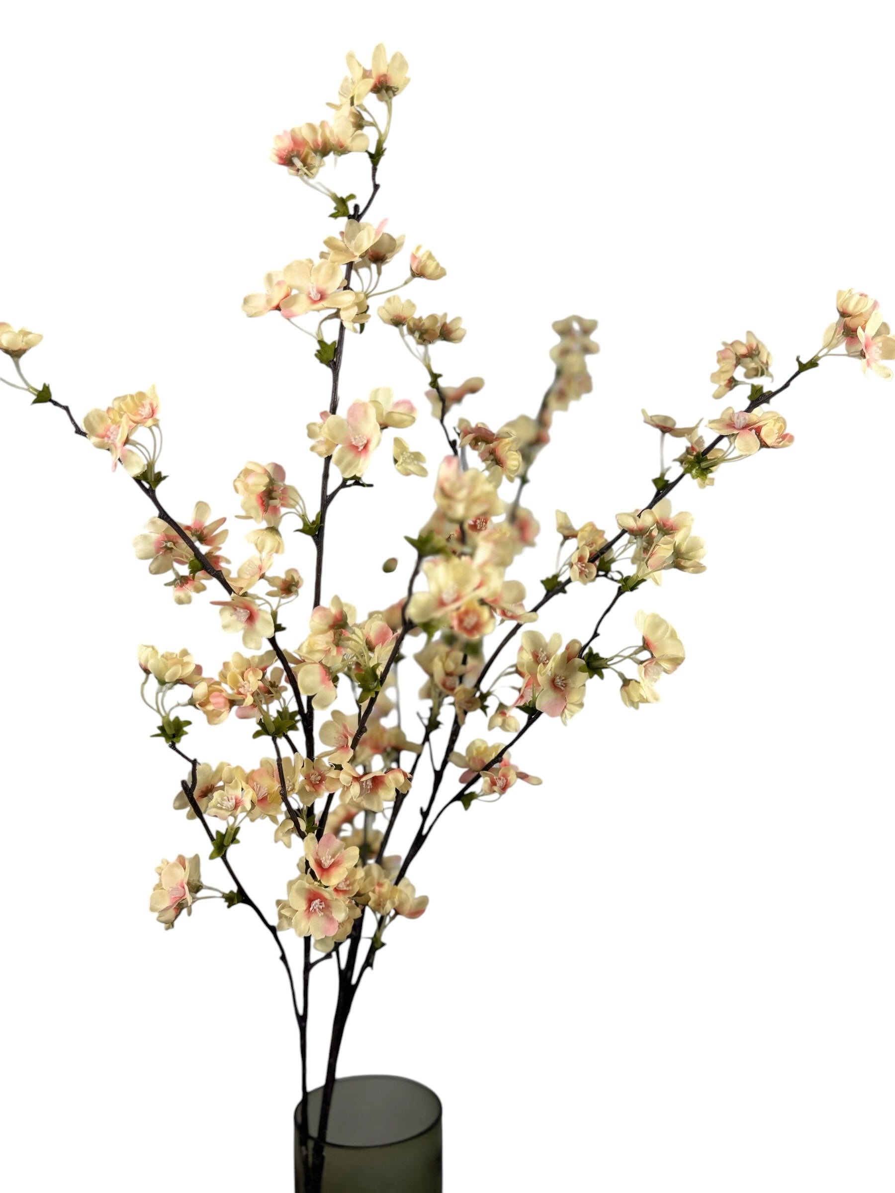 Artificial Bloom decorative cherry blossom branch with cream and blush-pink petals on dark textured stems in a vase