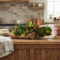 Artificial Bloom succulent arrangement featuring vibrant green and purple plants in a rustic natural driftwood base.