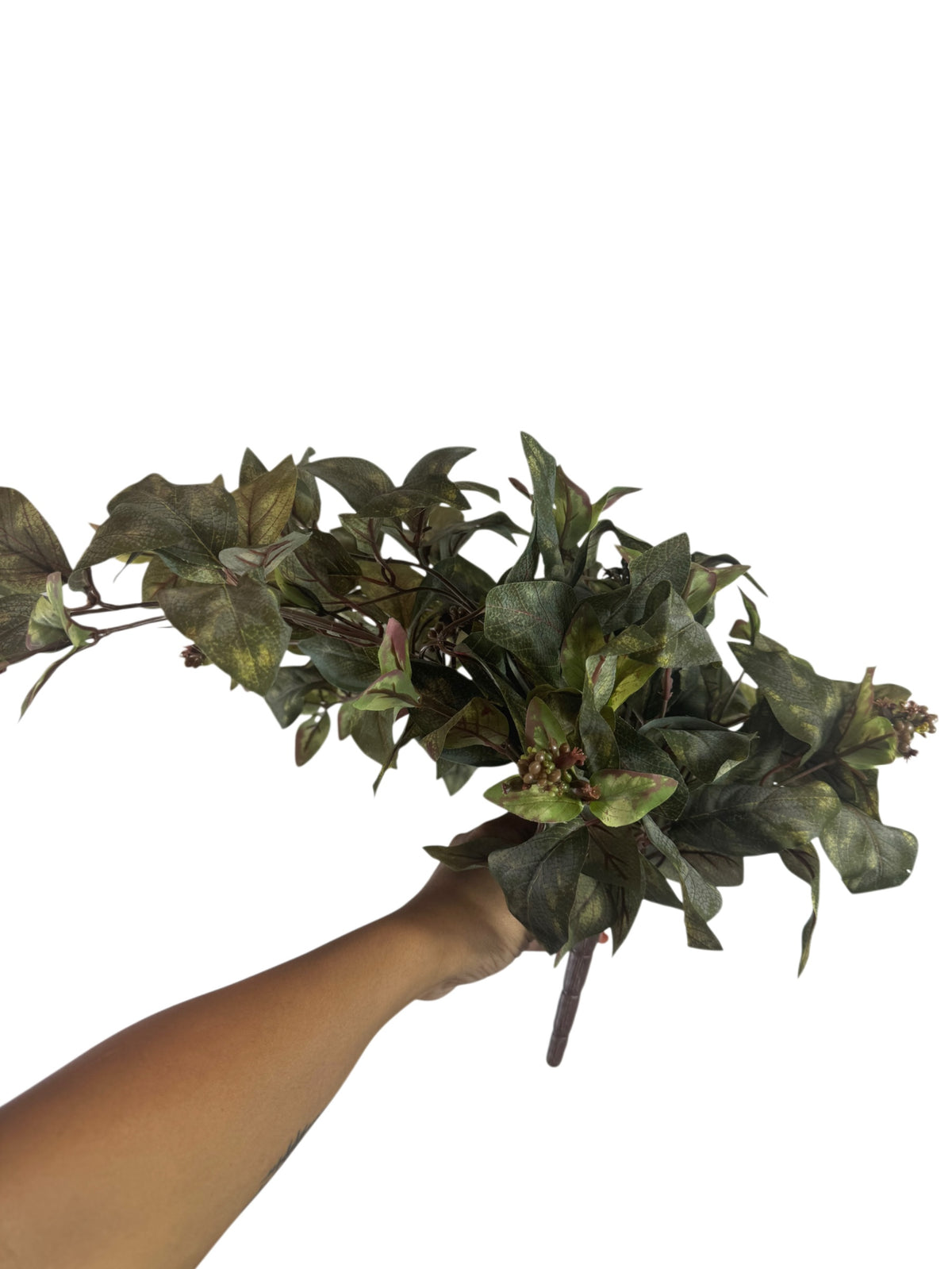 Artificial Bloom faux foliage stem with variegated forest green and burgundy leaves held against a white background