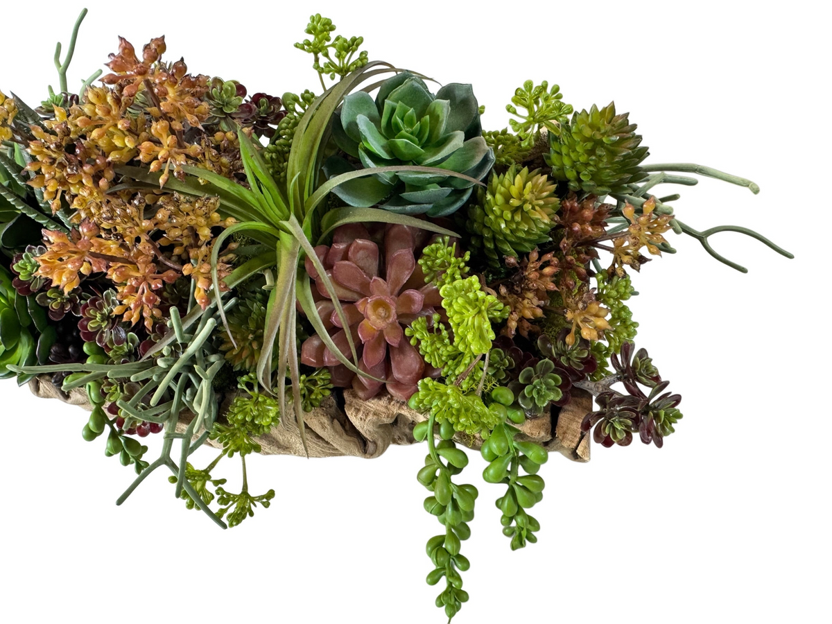 Artificial Bloom faux succulent arrangement in a textured driftwood-style bowl with green, rust, and sage foliage.