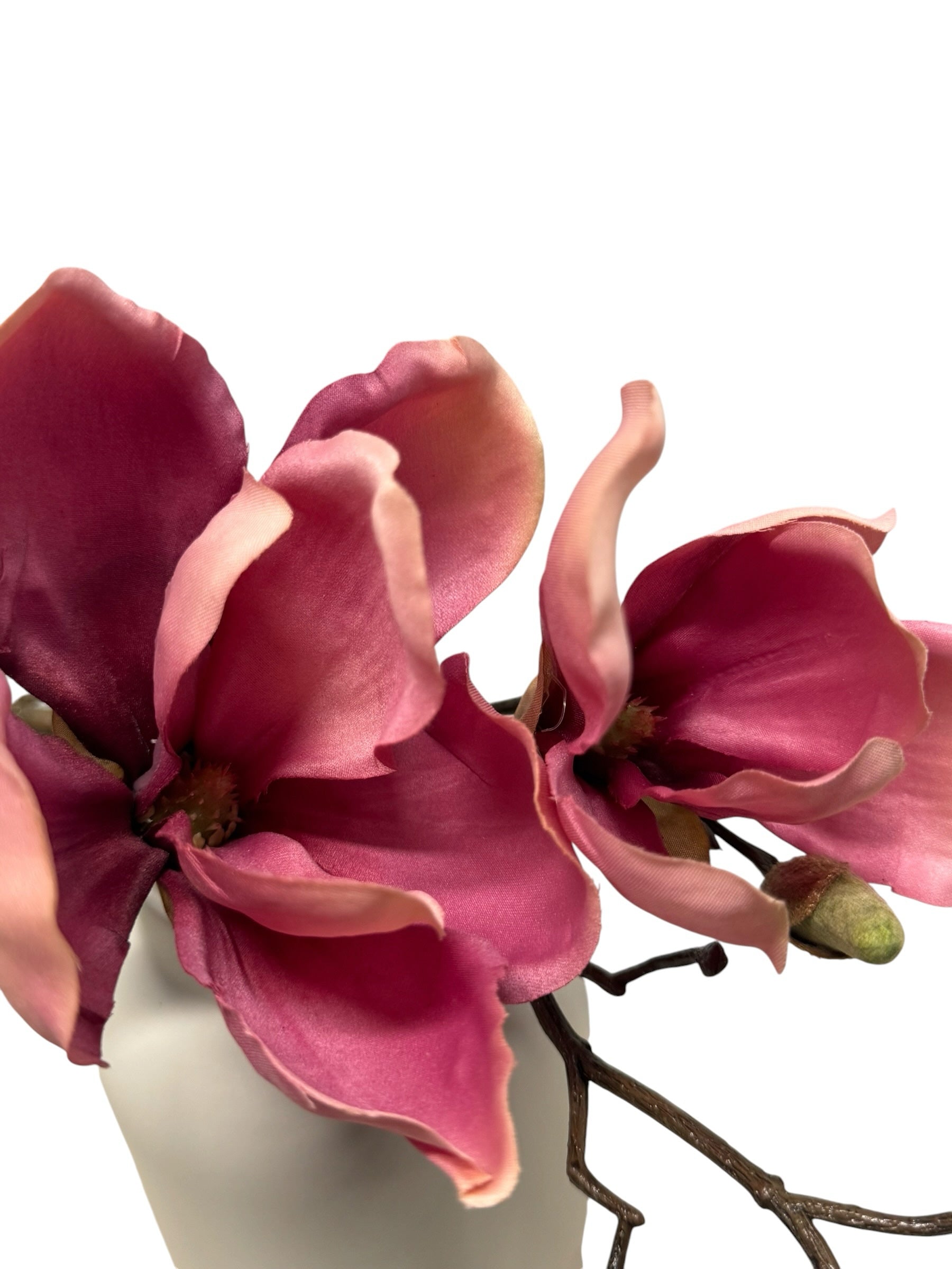 Artificial Bloom magenta and pink velvet magnolia floral stem in a white vase for home decor