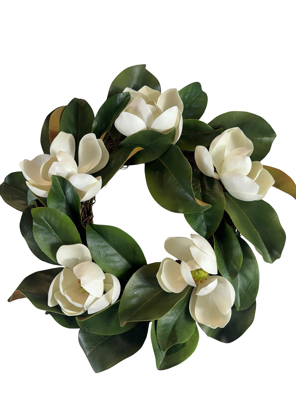 Artificial Bloom magnolia floral wreath featuring creamy white blossoms and lush deep green leaves on a round base.