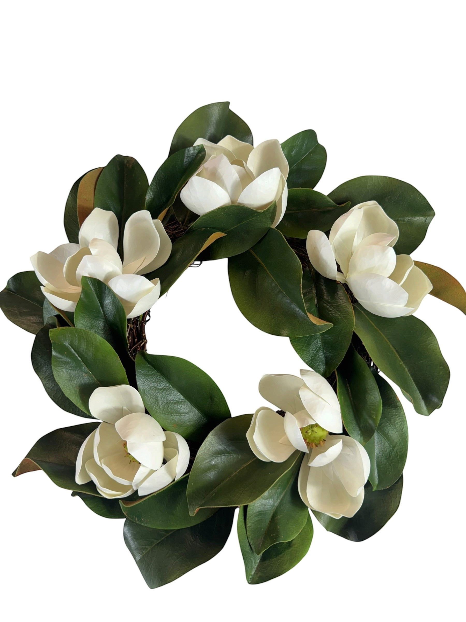 Artificial Bloom magnolia floral wreath featuring creamy white blossoms and lush deep green leaves on a round base.