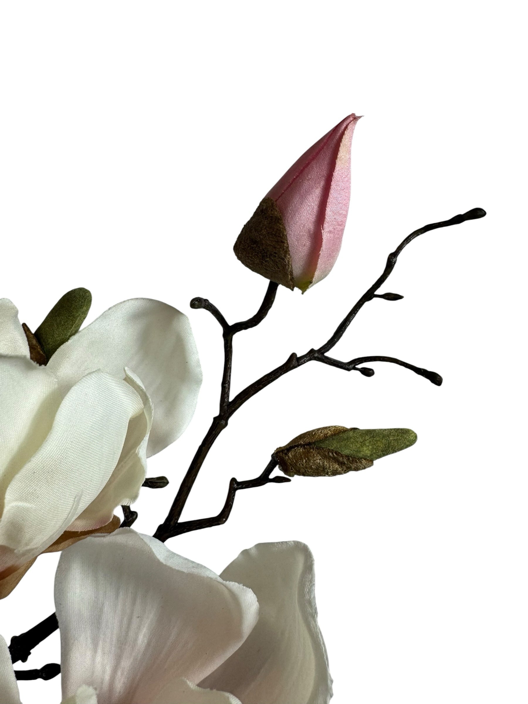 Artificial Bloom magnolia stem with creamy white petals, pink buds, and a dark rustic branch on a white background