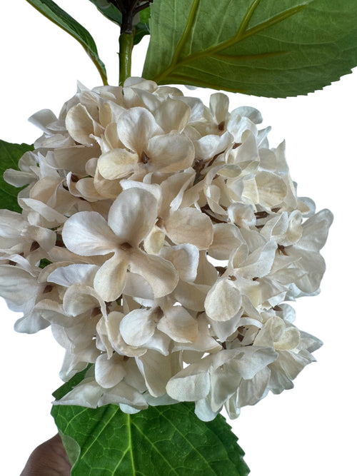 Artificial Bloom creamy off-white fabric hydrangea stem with realistic green leaves and detailed layered petals
