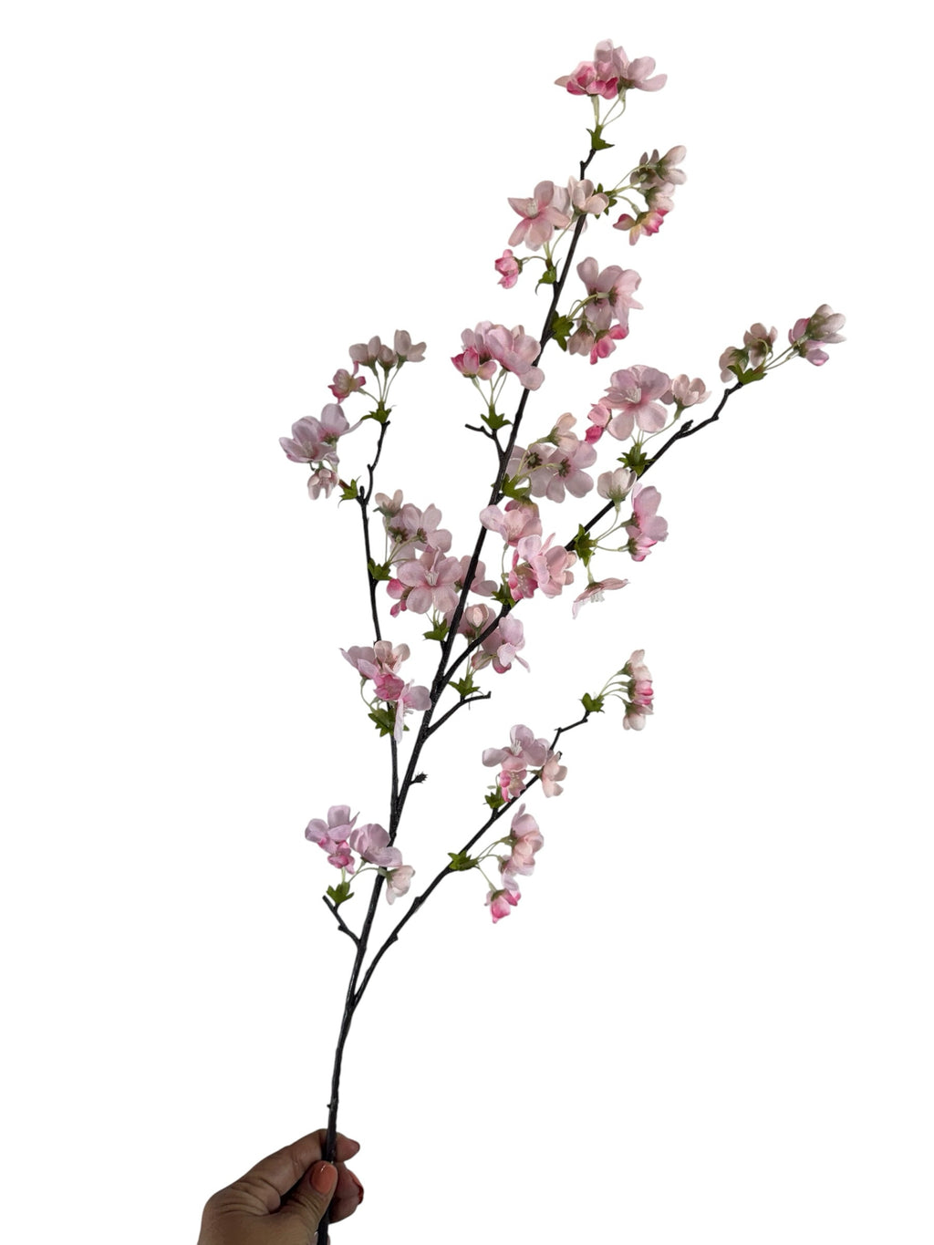Artificial Bloom cherry blossom stem with soft pink silk petals and a dark textured branch held against white