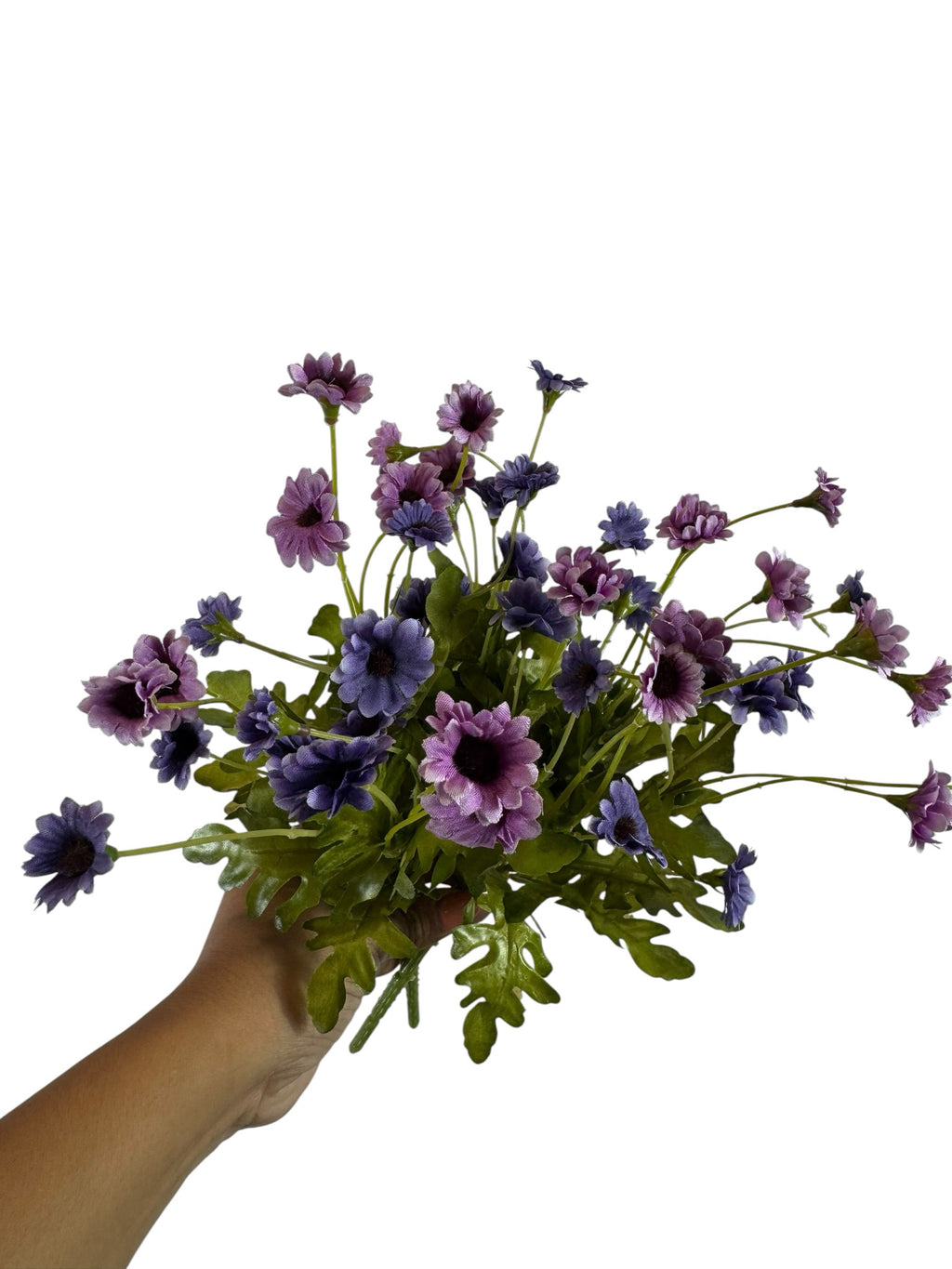 Artificial Bloom purple and lavender fabric daisy bouquet held in hand against a white background