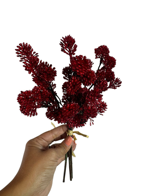 Artificial Bloom red berry branch bundle held in a hand, featuring textured faux floral clusters for festive decor.