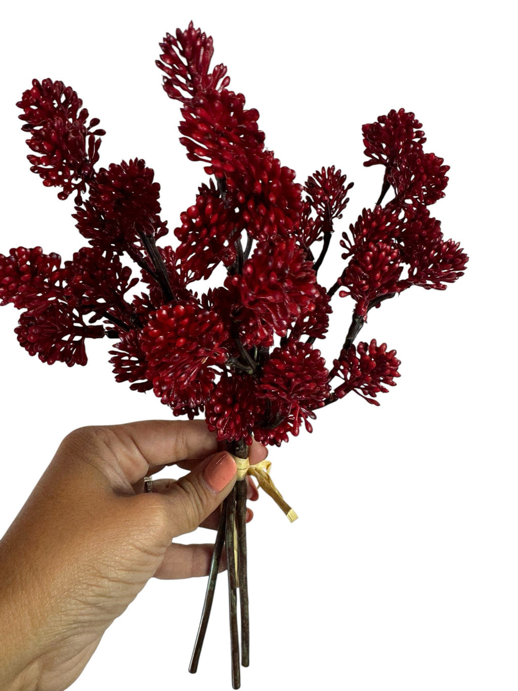 Artificial Bloom red berry branch bundle held in hand, featuring textured faux floral clusters for festive decor.