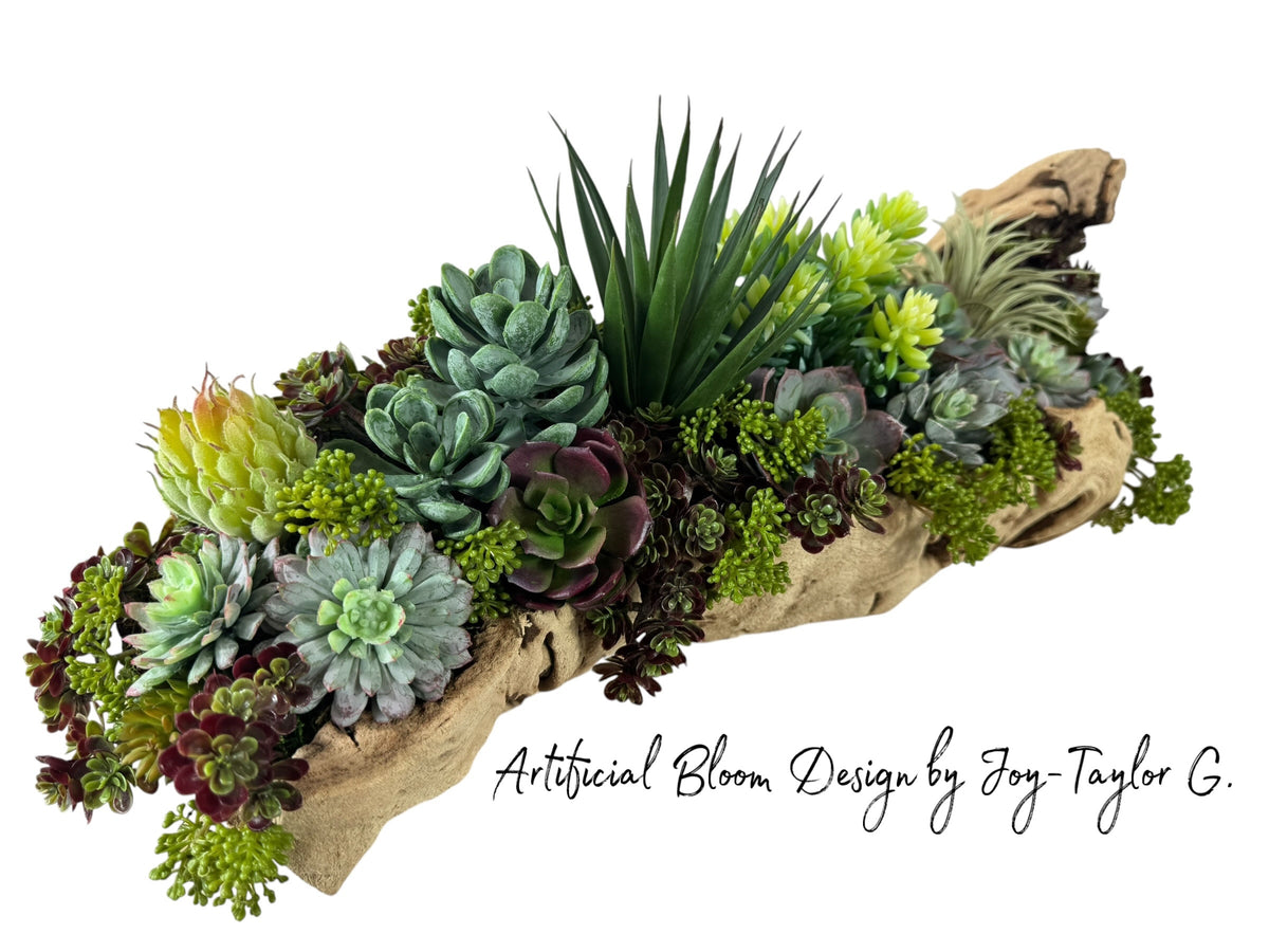 Artificial Bloom succulent arrangement featuring echeveria, agave, and sedum in a rustic driftwood base.
