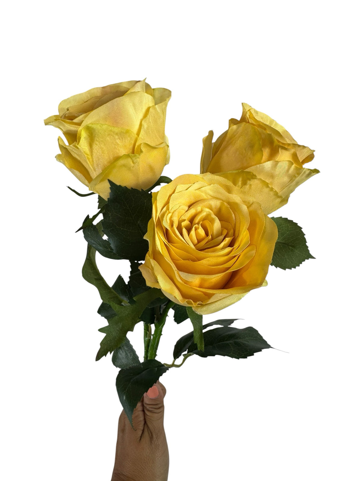 Artificial Bloom yellow silk rose stem bouquet with realistic green leaves held against a white background